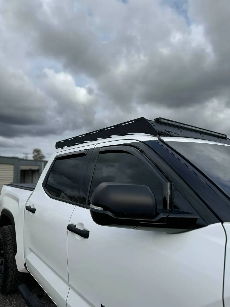 White Toyota Tundra with full window tint