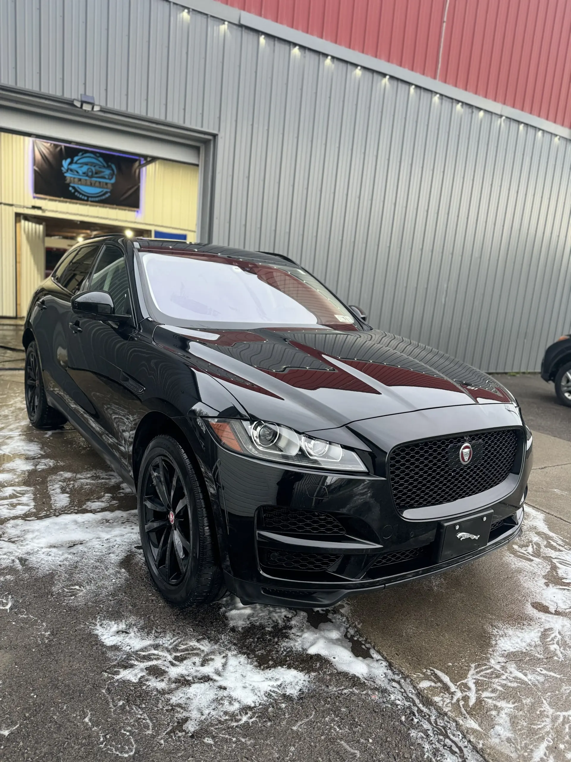 Black Jaguar F-PACE after professional exterior detailing