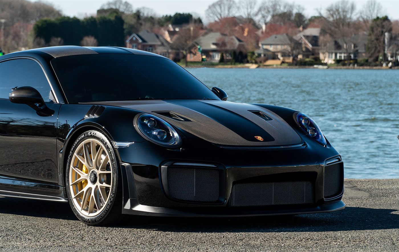 Black Porsche with dark tinted windows
